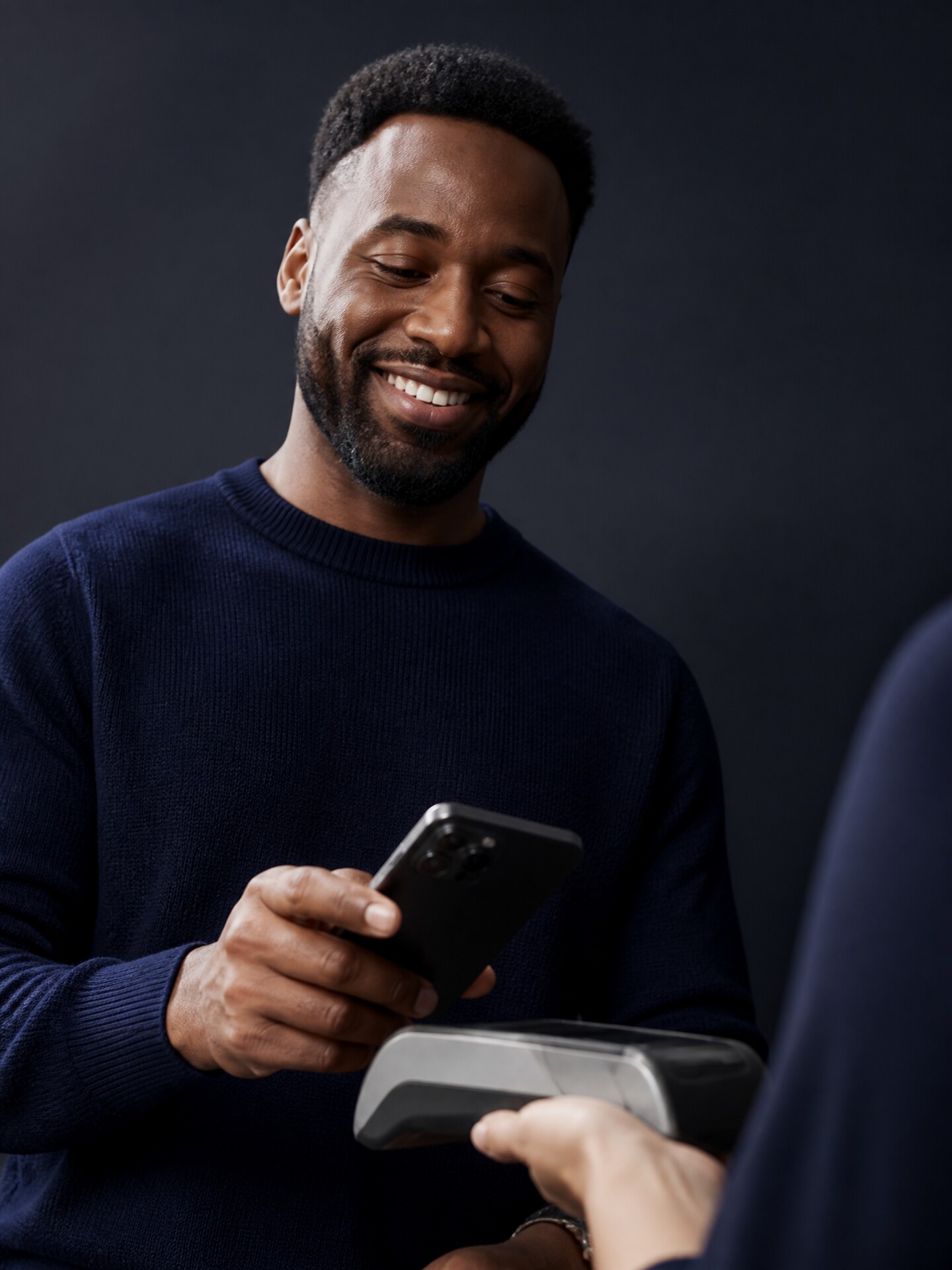Customer paying with a smartphone